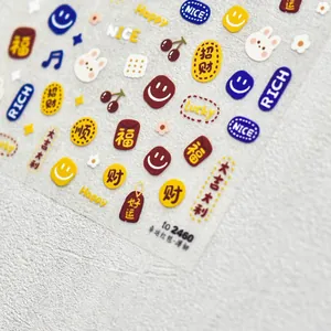 Detailed view of embossed nail art stickers with red envelopes and lucky charms