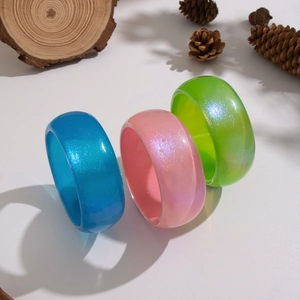 Sparkly wide acrylic bangles in blue, pink and green with glitter finish and resin texture