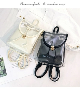 Detail of transparent PVC mini backpacks in white and black with inner pouches