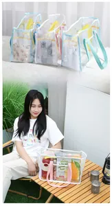 Outdoor lifestyle shot of multi-color PVC mesh tote bags with spacious compartments