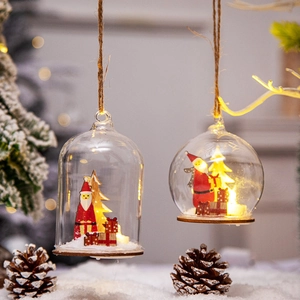Christmas glass globe night light ornament with miniature Santa and warm LED glow