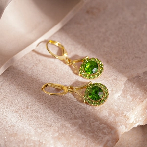 Vintage round geometric hoop earrings with green crystals in gold-plated finish