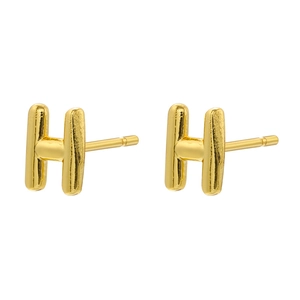 Detail of H-shaped stud earrings in 18K gold plated copper with a polished finish