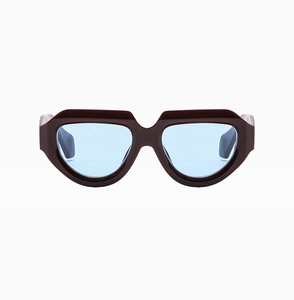 Close-up of trendy irregular burgundy sunglasses with blue lenses