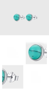 Macro detail of S925 sterling silver stamp and round turquoise stone on the stud earrings
