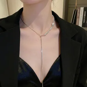 Elegant Y-shaped necklace with silver beads and a pearl drop on a snake chain