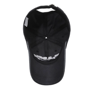 Internal view of adjustable black cotton baseball cap with ventilation and wash labels