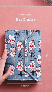 Detail view of Japanese lucky cat organizer showing 182mm by 140mm dimensions in hand