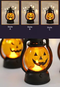 Detail of three Halloween pumpkin lanterns with different scary faces and LED lighting