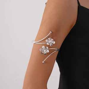 Silver flower arm cuff with crystal inlay and spiral textured wrap design for women