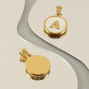 Golden stainless steel necklace with a round white pendant and gold initial letter A