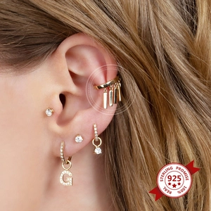 Minimalist 18k gold geometric long drop earrings and ear cuff set worn by a model