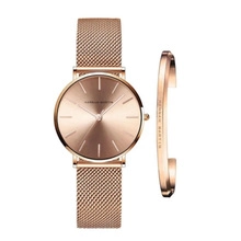 Elegant rose gold watch with mesh strap and matching C-shaped bracelet set for women