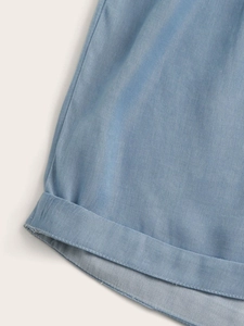 Close-up of light blue twill cotton shorts showing premium stitching and hem details