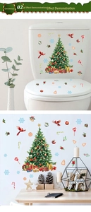 Detail of Christmas wall stickers featuring snowman, red birds, and festive candy patterns