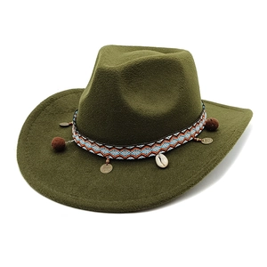 Detail of wool western cowboy hat with bohemian woven band and decorative shell charms