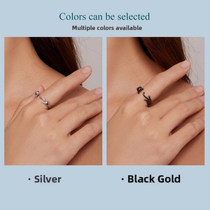 Close-up of adjustable S925 sterling silver black cat ring in silver and black gold finishes
