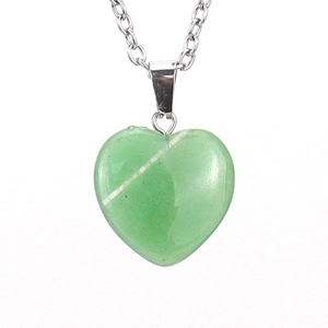 Close-up of a 2cm green natural stone heart pendant on a polished metal chain necklace