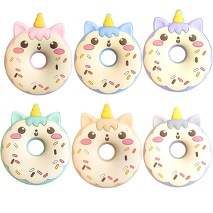 Assorted unicorn donut slow rising squishy toys in six pastel colors with golden horns