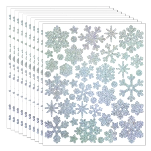 Detail of silver glitter snowflake stickers for festive DIY Christmas card decoration