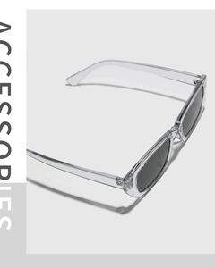 Detail of retro sunglasses with transparent frames and dark lenses for outdoor use