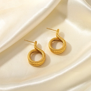 Elegant 18k gold plated stainless steel snake earrings with scale texture on silk