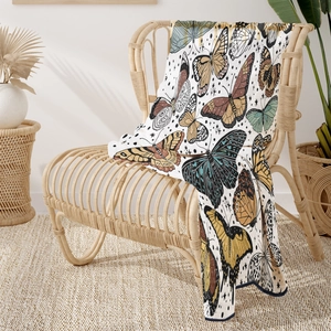 Soft bohemian flannel blanket featuring colorful butterfly patterns on cream base