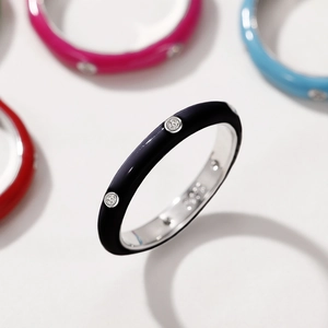 Detailed view of the black enamel ring with small sparkling cubic zirconia stones