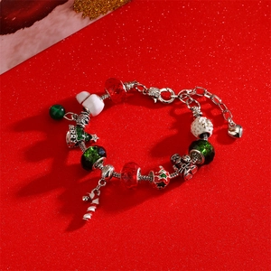 Adjustable Christmas bracelet with red beads, snowman, and candy cane charms on red base
