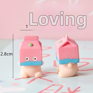 Miniature pink and blue milk box resin pig figurine showing 1.5x2.8cm dimensions