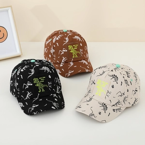 Kids dinosaur baseball caps in black, brown, and beige with fun skeleton prints