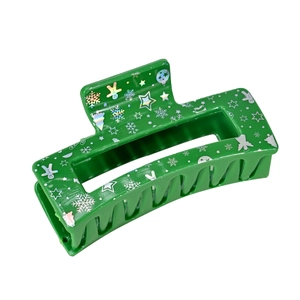 Green Christmas acrylic hair claw clip with holographic festive patterns on white background