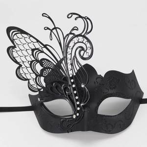 Detail of black butterfly masquerade mask with sparkling glitter and crystal rhinestones