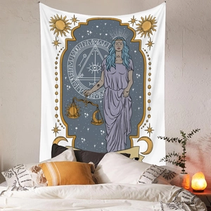 Detailed macro view of celestial Libra goddess tapestry hanging over a bedroom headboard