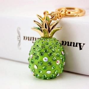 Sparkling green pineapple keychain with crystals and gold-tone metal hook for bags