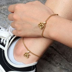 18K gold plated chain necklace with personalized 90s number charms on a model
