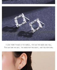 Detail of square geometric s925 silver stud earrings with inlaid rectangular zircons