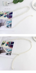Detailed view of elastic pearl waist chain with metal hook for elegant dress accessories