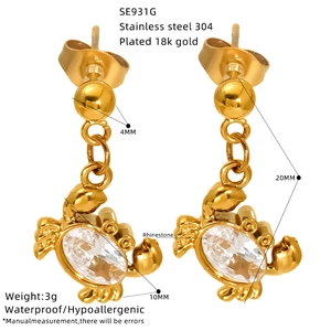 Golden titanium steel crab earrings with zircons and product dimensions on white background