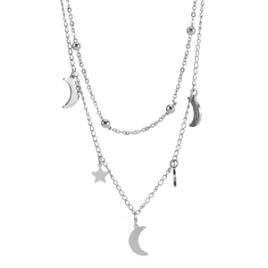 Detailed macro view of silver double-layer titanium steel necklace with star and moon charms
