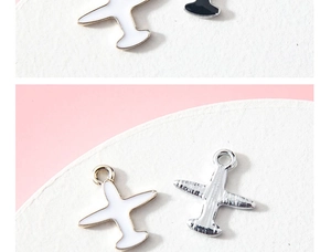 Front and back view of cartoon airplane pendant with white enamel and golden plating