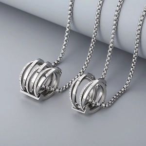 Macro shot of silver multi-layer pendant with sparkling crystals and box chain