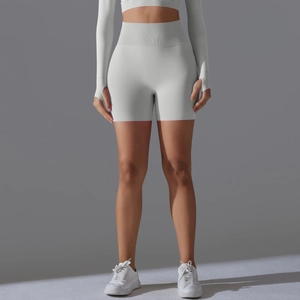 Close-up of seamless yoga shorts and long sleeve crop top with thumb hole detail