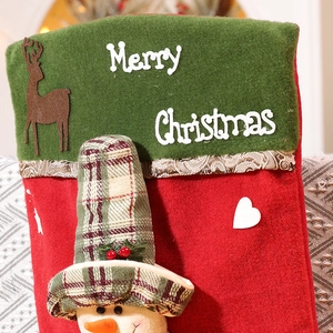 Macro detail of Christmas stocking with 3D deer figure and Merry Christmas text