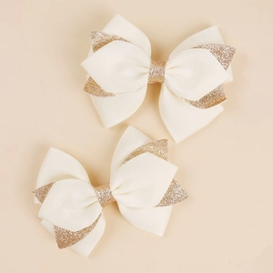 Pair of beige and glitter gold swallowtail bow hair clips for girls hair accessories