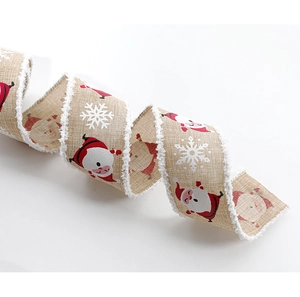 Close-up of Santa Claus and snowflake pattern on beige linen ribbon with white plush edges