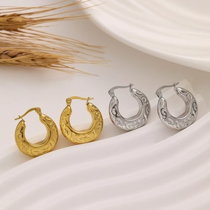 Vintage C-shaped titanium steel hoop earrings with embossed floral patterns for women