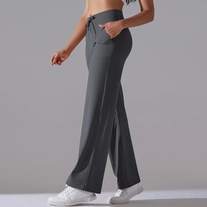 Macro detail of high waist drawstring on dark gray wide leg yoga pants with side pockets