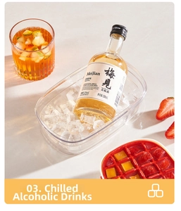 Close-up of clear ice bucket with ice cubes and 330ml bottle for chilling drinks