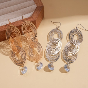 Elegant multi-layered gold and silver oval drop earrings with sparkling zircon dangles
